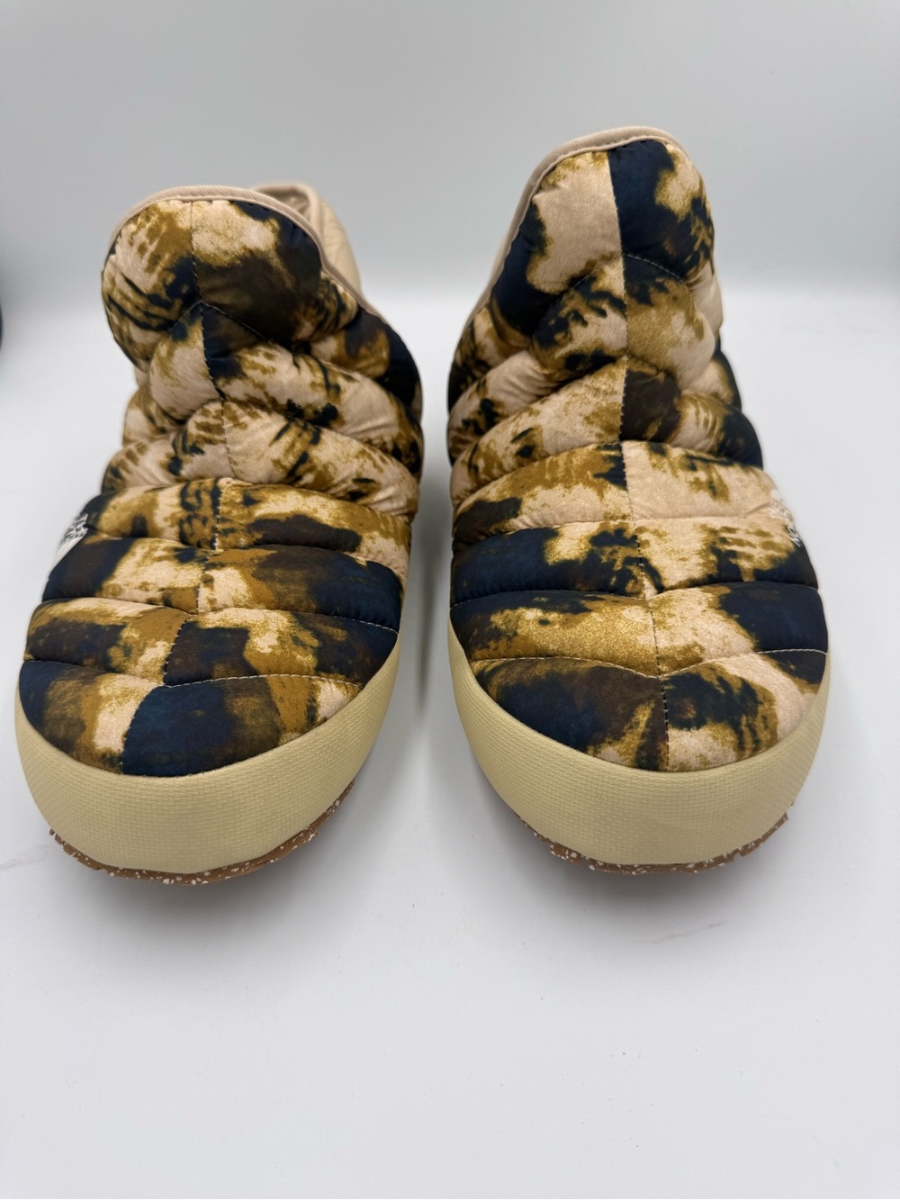 The North Face Men’s Quilted Slip-On Boots in Black and Tan